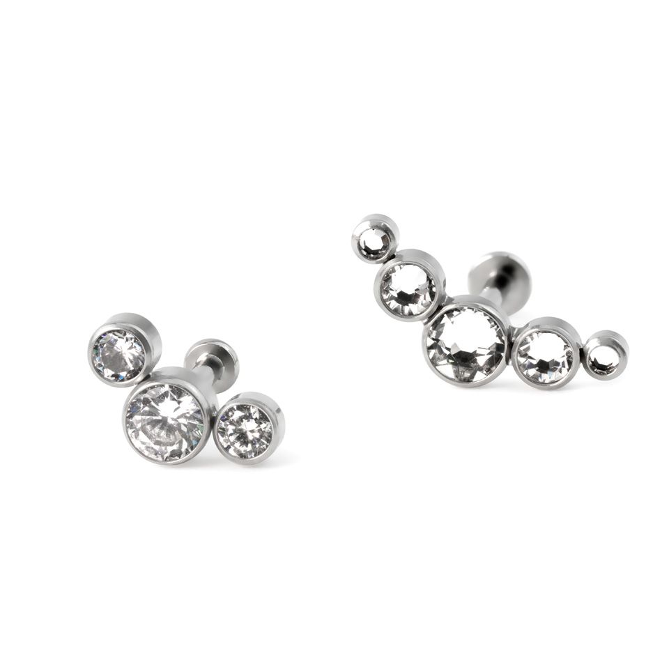 Labret av titan med push-in topp i forskjellige farger med innfattet sten