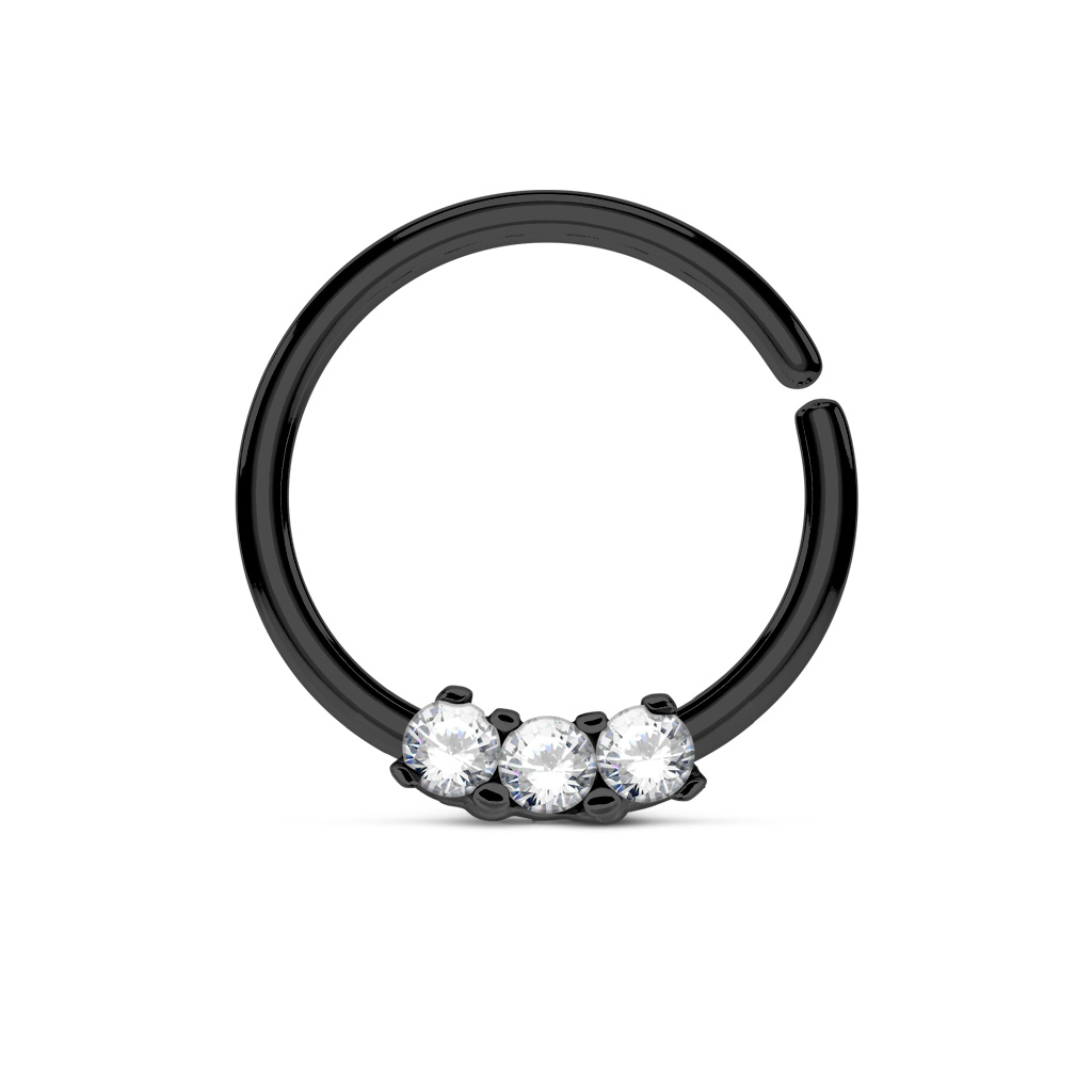 Liten septumpiercing med tre små stener