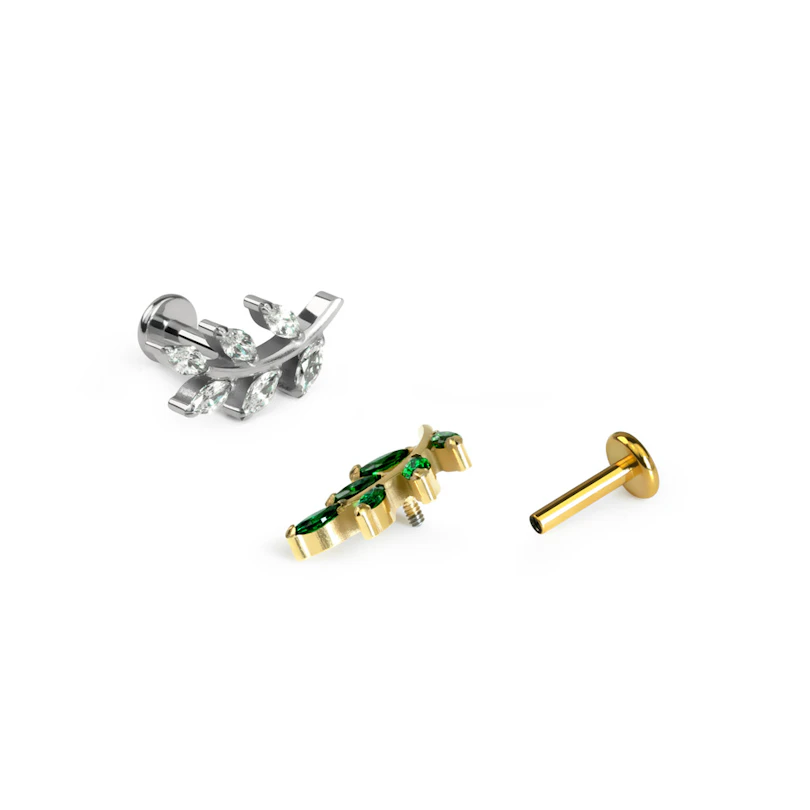 Labret i form av blad med stener