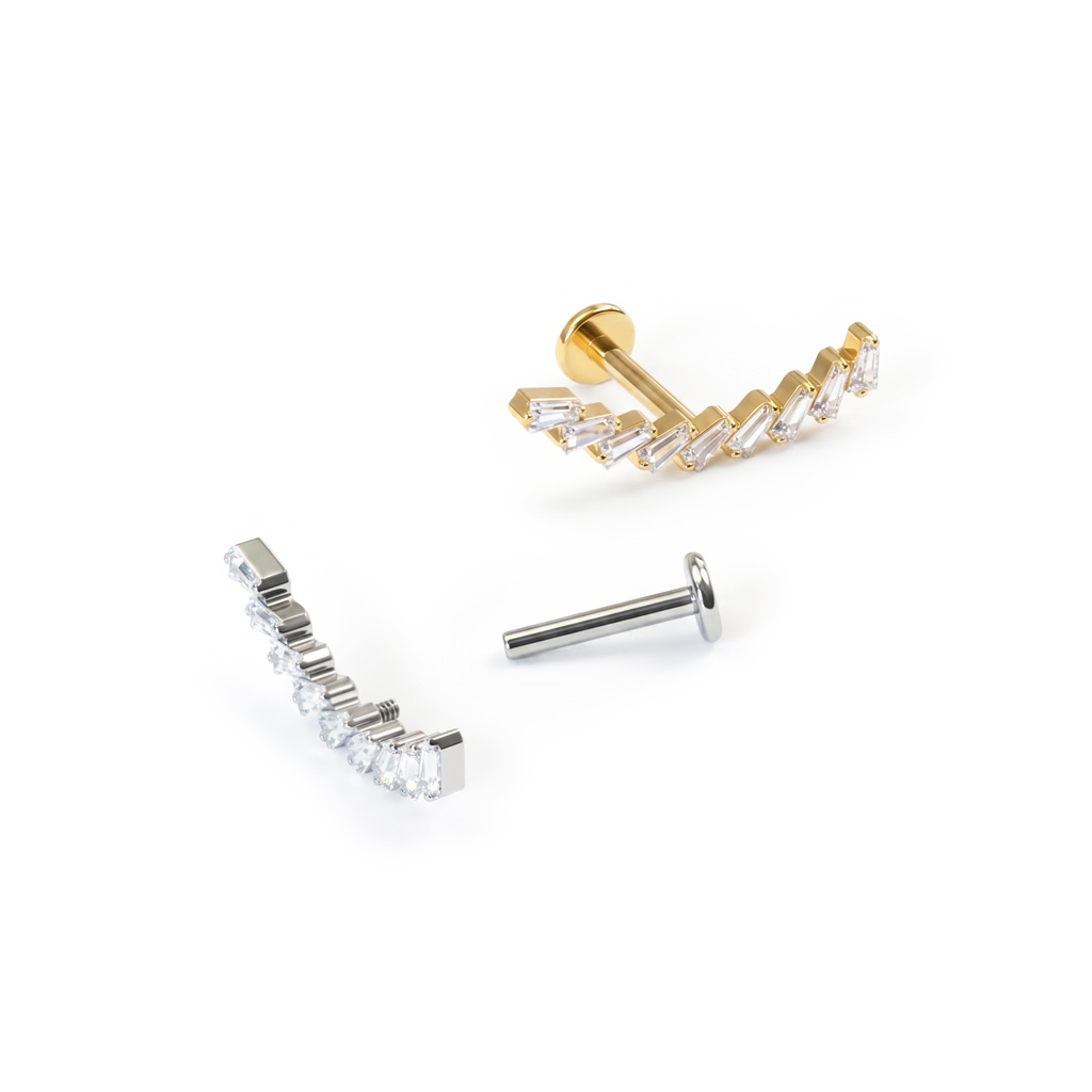 Labret av titan med bue av stener