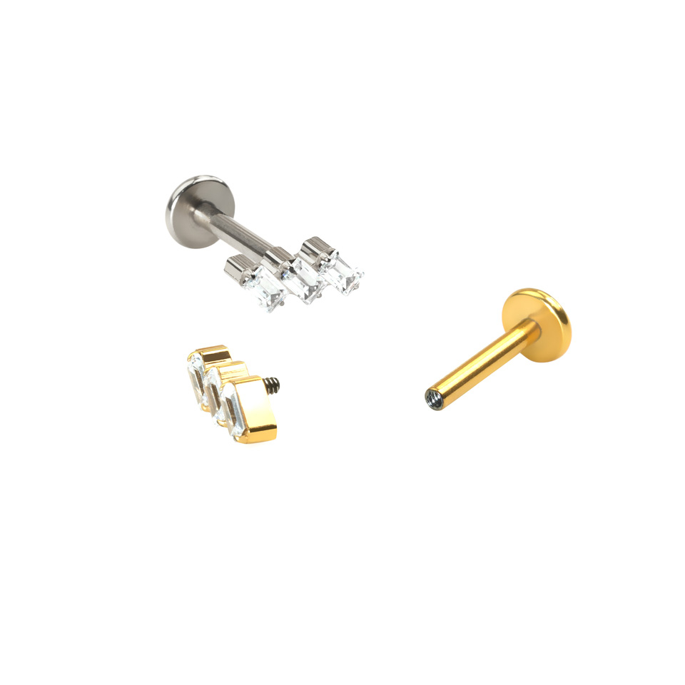 Labret av titan med baguettslipte stener