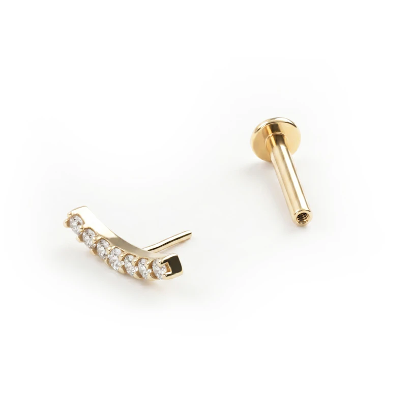 Push-in labret av gull med bue av sten
