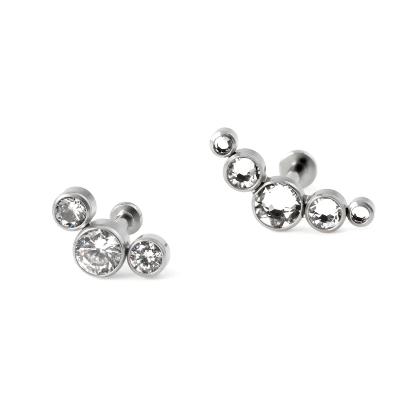 Labret av titan med push-in topp i forskjellige farger med innfattet sten