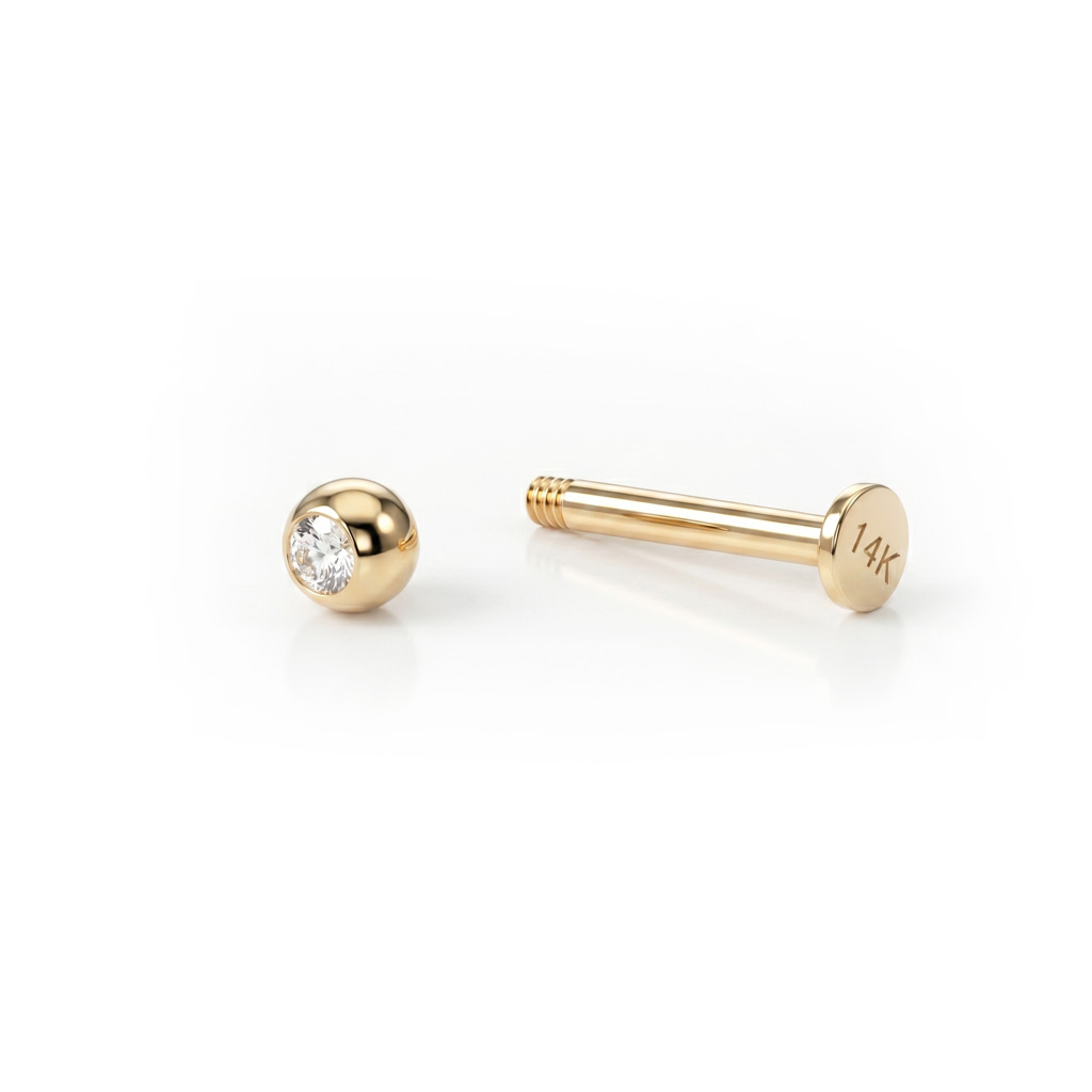 Labret av 14K gull med sten