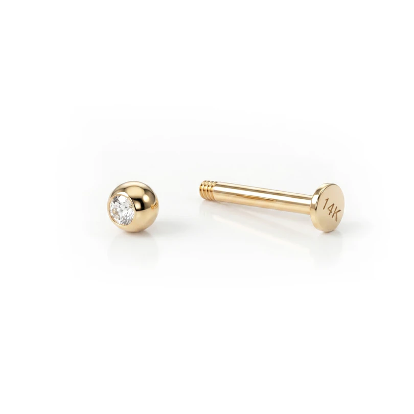Labret av 14K gull med sten