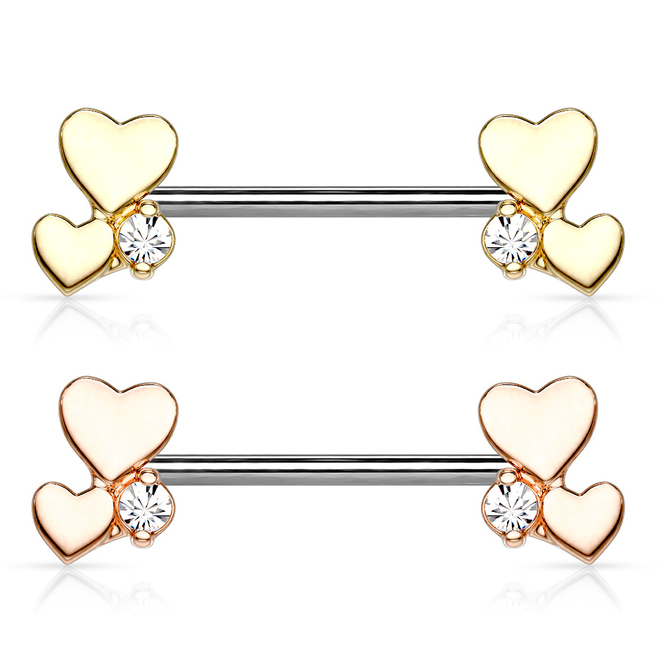 Brystpiercing med to hjerter og en sten i hver ende