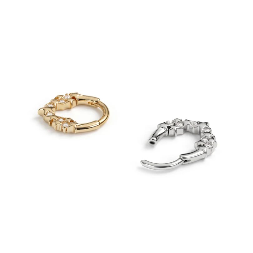 Forovervendt ring med stjerner og stener